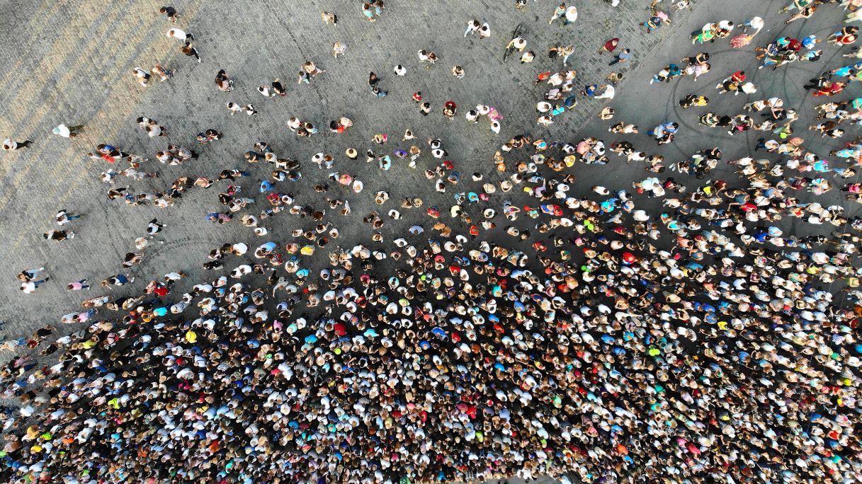 Aerial. Hundreds of people. Crowd of people top view from drone.